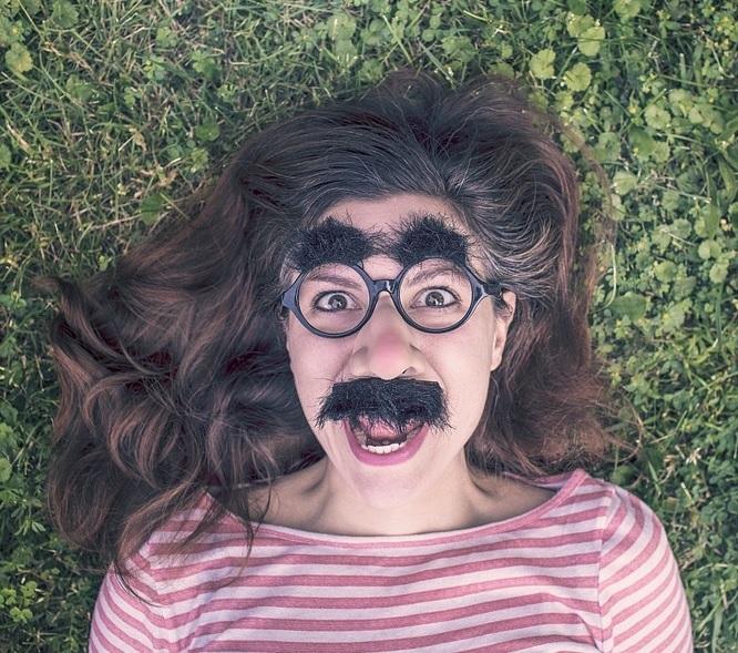 Ashley, unshaven with a mustache and unibrow